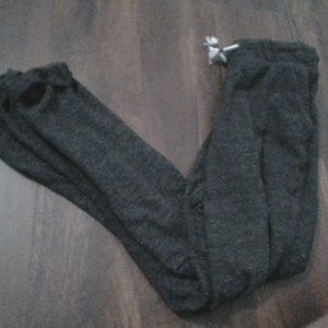 Grey sweatpants cuffed.